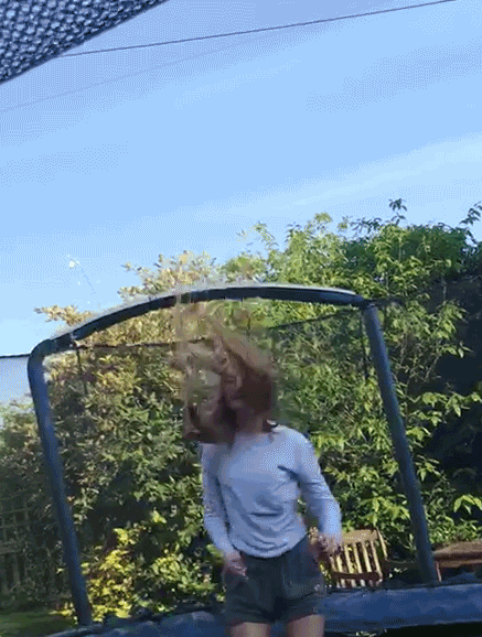 A person bouncing on a trampoline
